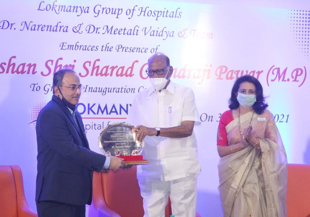 Shri Sharad Pawar with Dr Narendra Vaidya and Meetali Vaidya during the launch of Lokmanya HSS1 copy