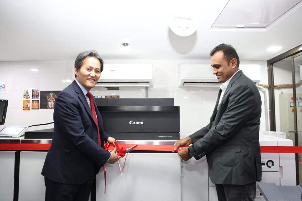 Picture 3- Mr. Manabu Yamazaki, President and CEO, Canon India inaugurating the imagePRESS V1350 with Mr Rajesh Mandora, Owner, Prince Graphics