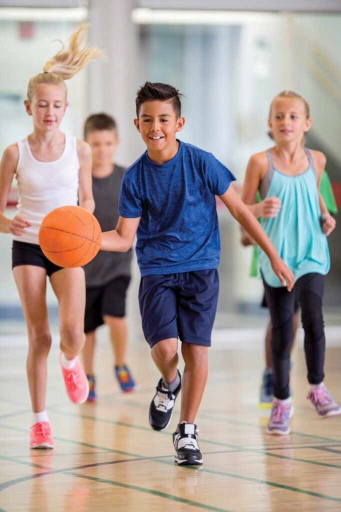 Children Playing Basketball at the Gym