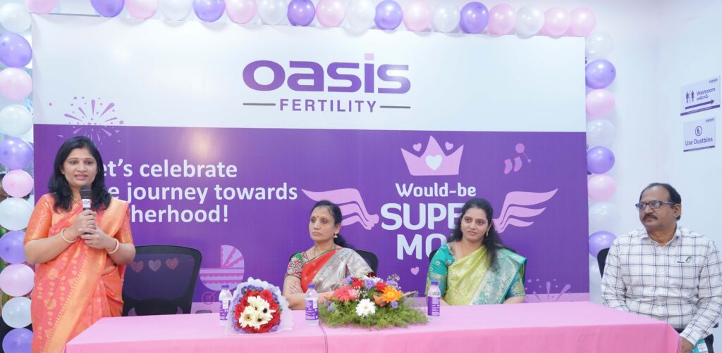 Dr Jigna Tamagond, (Extreme Left) Consultant Fertility Specialist, Oasis Fertility, Karimnagar; addressing the gathering at the Mass Baby Shower hosted by Oasis Fertility, today at Karimnagar; as (L-R) Chief Guest Dr Lalitha Devi, DMHO; Dr Samyuktha, Fertility Specialist, Oasis Fertility, Karimnagar & Mr Ranga Reddy, District Medical Demo Officer; look on.