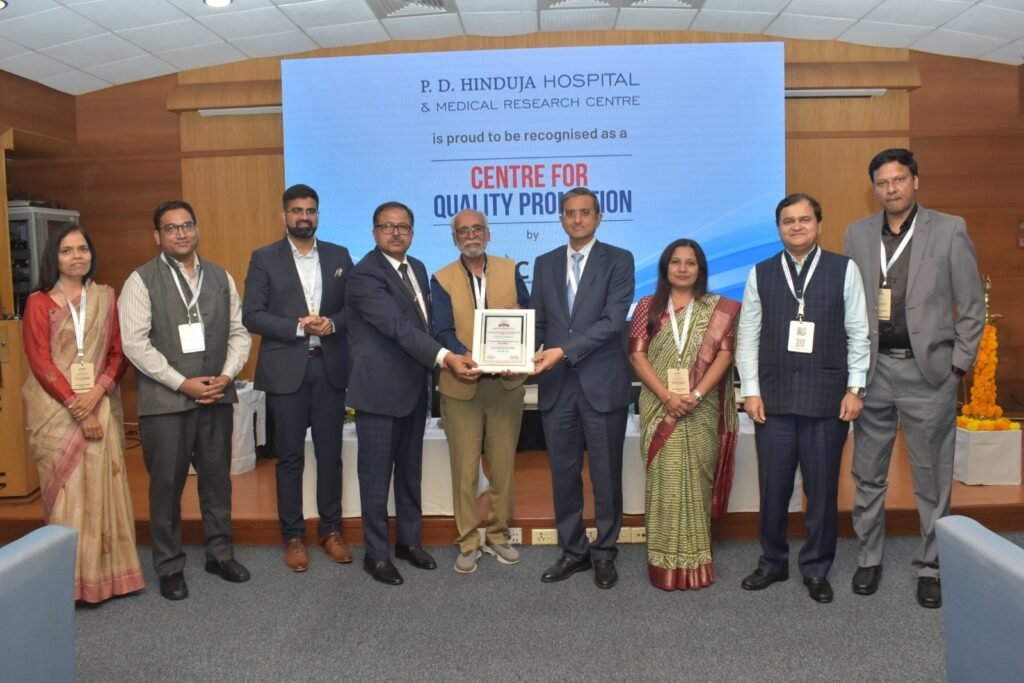 PD Hinduja Hospital & MRC leadership team (CEO, Mr Gautam Khanna & COO, Mr. Joy Chakraborty) receiving 'Centre for Quality Promotion' recognition from CAHO President, Dr. Vijay Agarwal