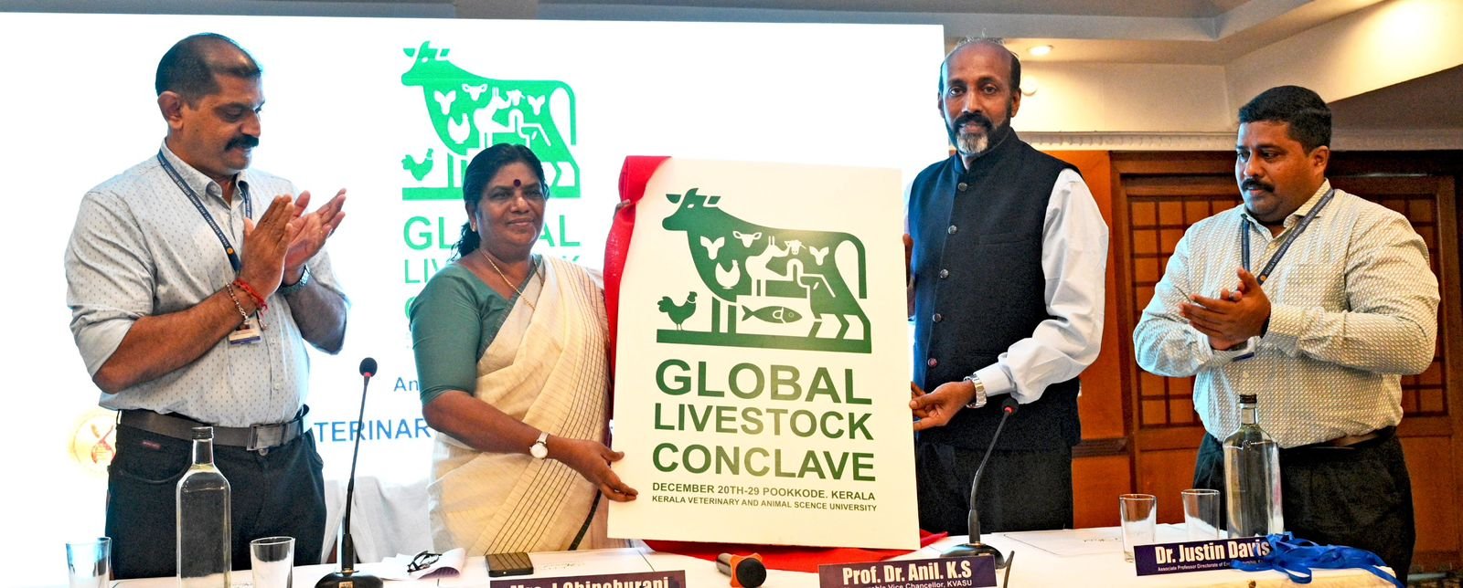 Minister J. Chinchurani unveils the logo for the Global Livestock Conclave, scheduled from December 20-29 at Kerala Veterinary University, Wayanad. Kerala Veterinary University Vice Chancellor Prof. Dr. Anil K.S., Director Dr. T.S. Rajeev, and Associate Professor Dr. Justin Davis were also present at the event